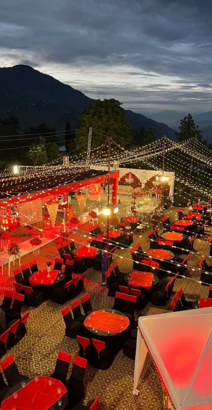 Oasis hilltop wedding with red theme and fairy lights